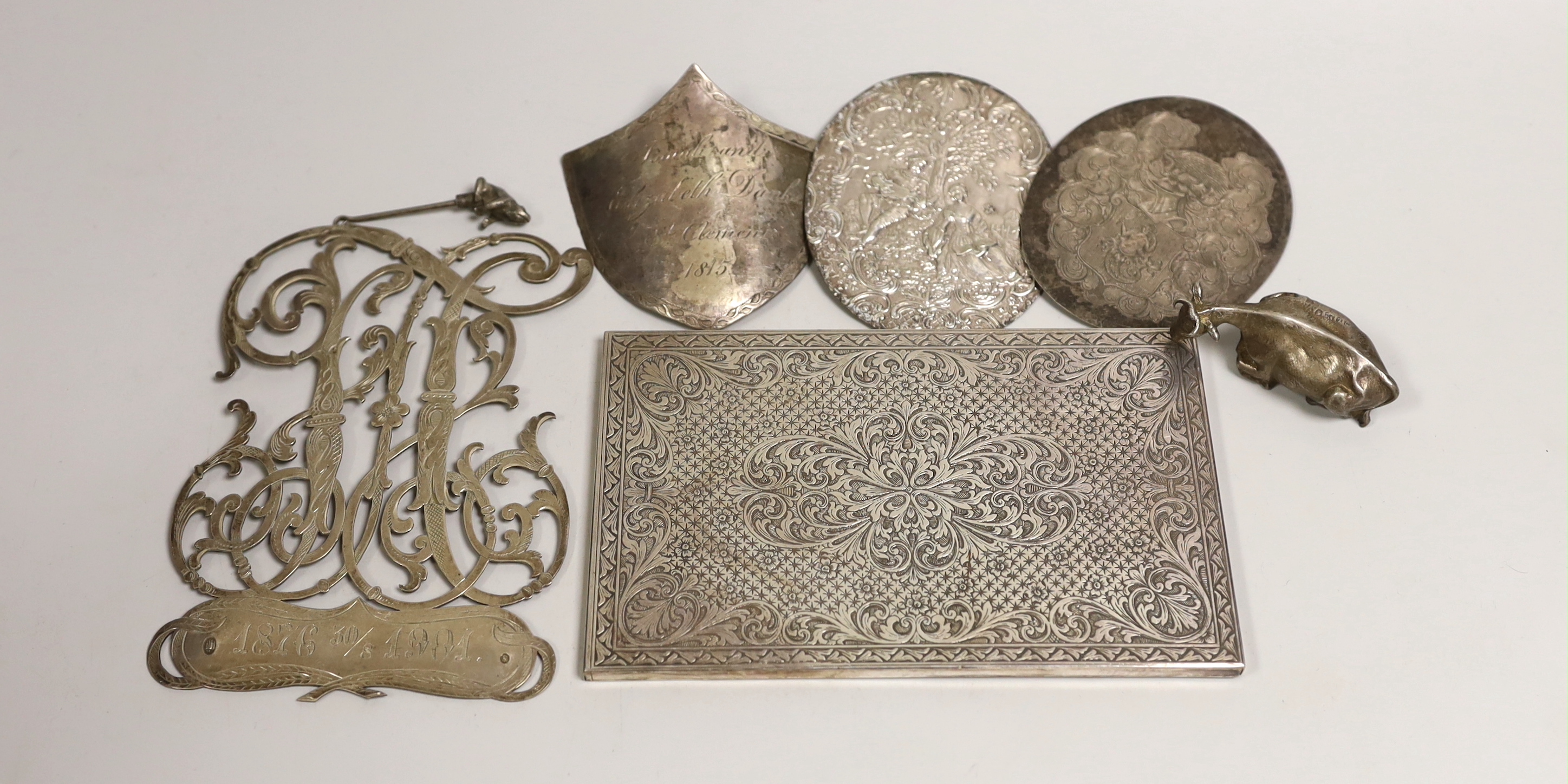 Silver and white metal items including a Swedish monogram appliqué, a Victorian silver butter dish finial, modelled as a cow and four other plaques and mounts, etc.